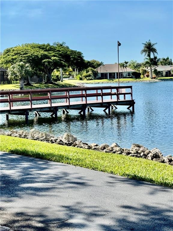 645 Squire Court, Unit 202 Naples, FL 34104 - Photo 38 of 41 a view of a lake with a lake