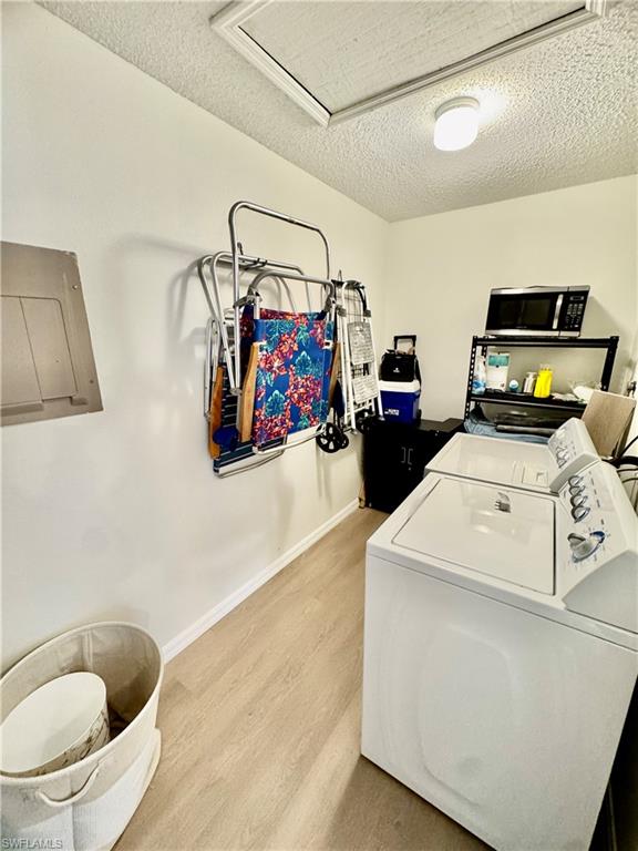 645 Squire Court, Unit 202 Naples, FL 34104 - Photo 7 of 41 a utility room with dryer and washer
