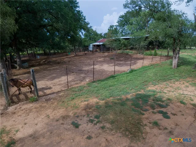 a view of a yard with entertaining space