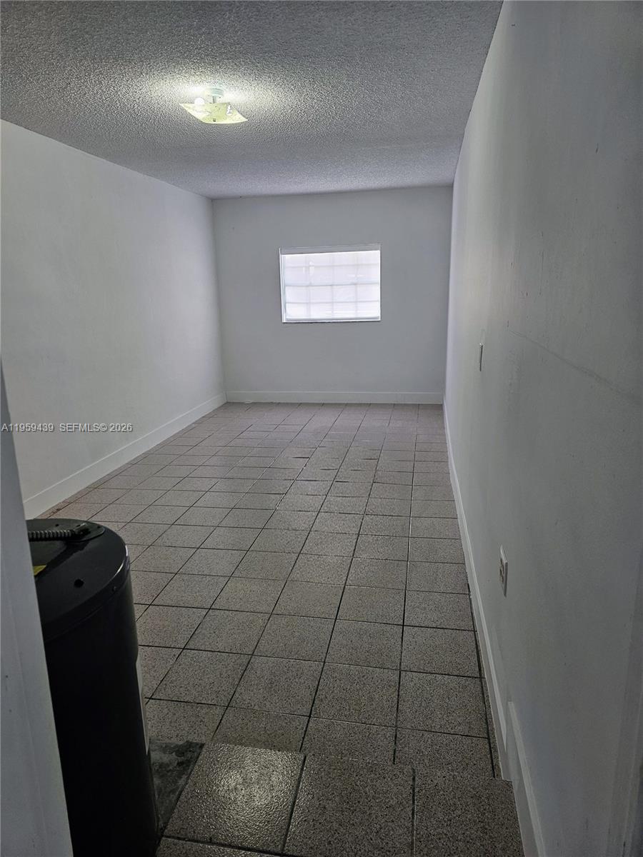 15581 Southwest 144th Court Miami, FL 33177 - Photo 31 of 37 a view of an empty room and window
