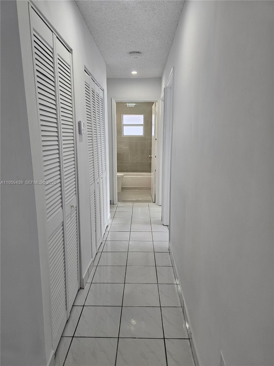 15581 Southwest 144th Court Miami, FL 33177 - Photo 37 of 37 a view of hallway with window
