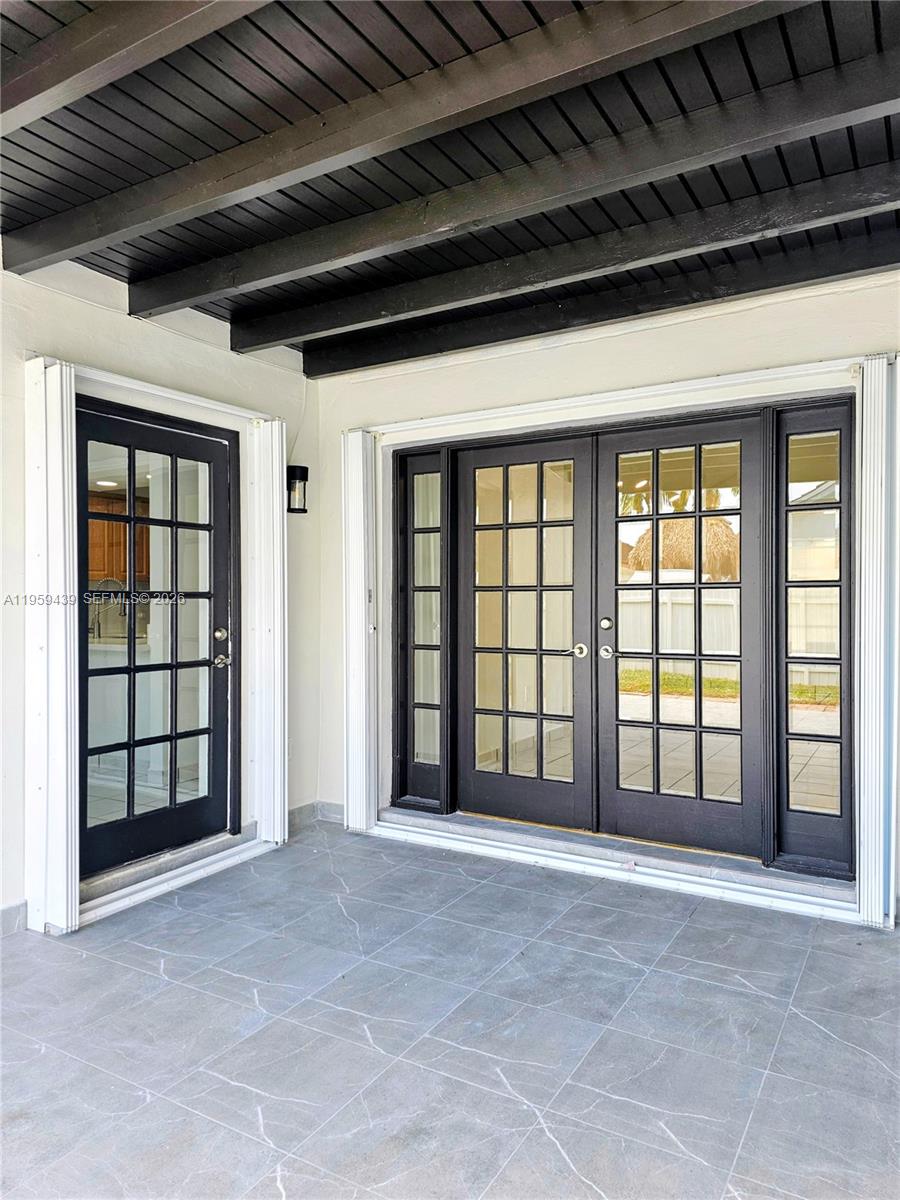 15581 Southwest 144th Court Miami, FL 33177 - Photo 4 of 37 a view of an empty room with a balcony