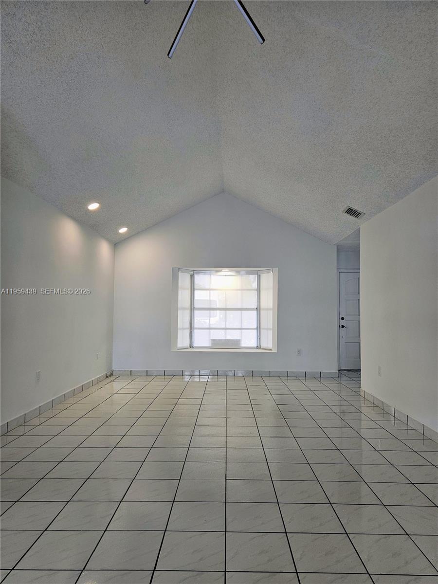 15581 Southwest 144th Court Miami, FL 33177 - Photo 8 of 37 an empty room with windows
