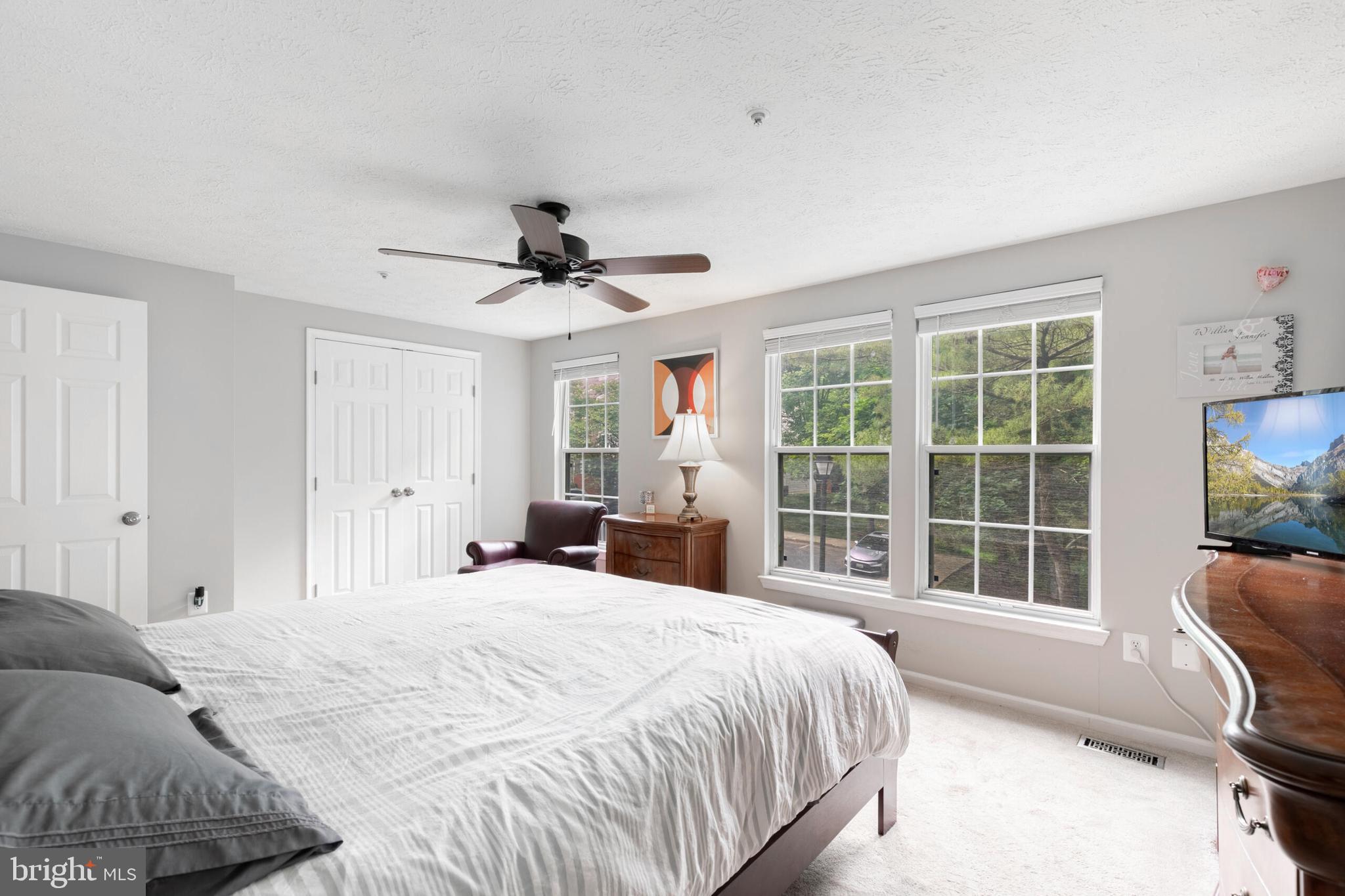 6058 Weekend Way, Unit G38 Columbia, MD 21044 - Photo 20 of 33 a bedroom with a large bed and a large window