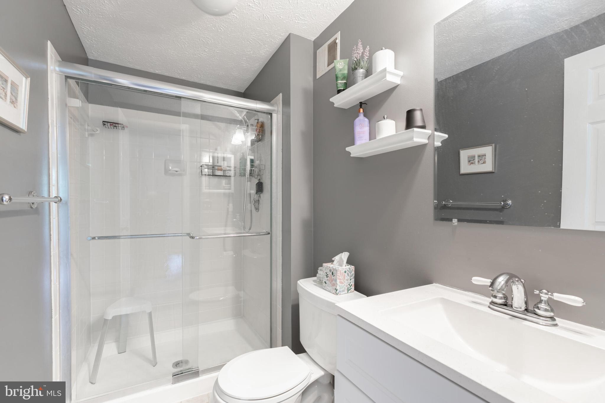 6058 Weekend Way, Unit G38 Columbia, MD 21044 - Photo 21 of 33 a bathroom with a sink a toilet and shower