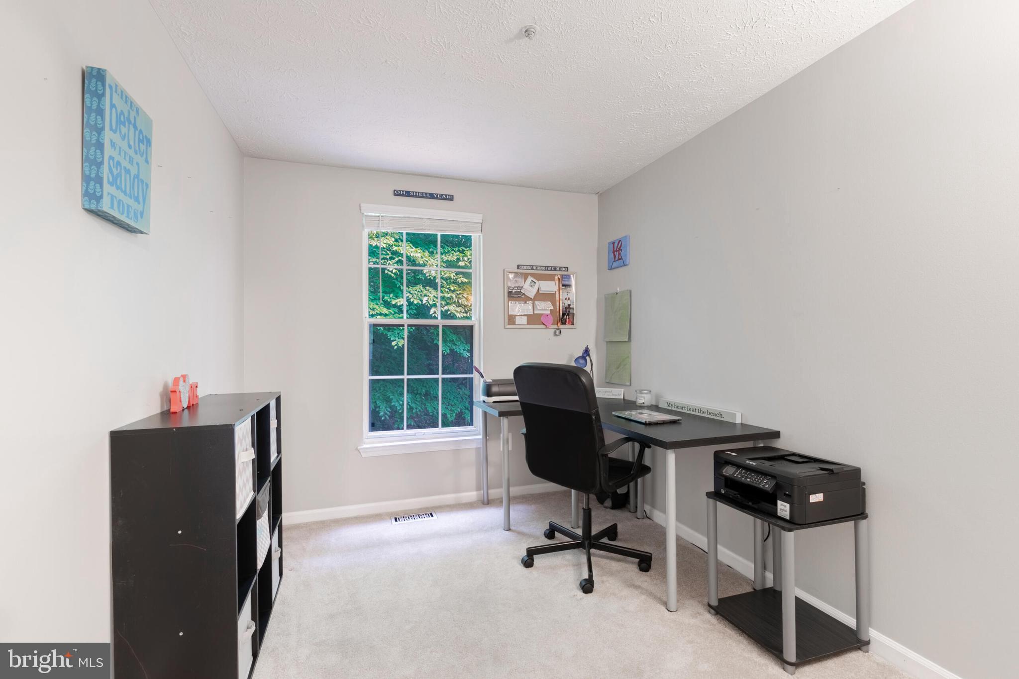 6058 Weekend Way, Unit G38 Columbia, MD 21044 - Photo 23 of 33 a view of a workspace with furniture and a window
