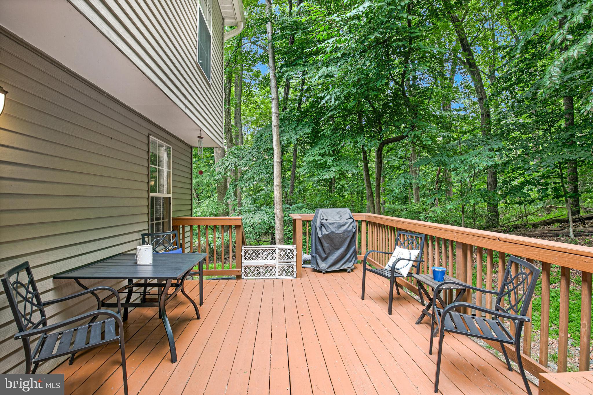 6058 Weekend Way, Unit G38 Columbia, MD 21044 - Photo 30 of 33 a view of a chairs and table on the wooden roof deck