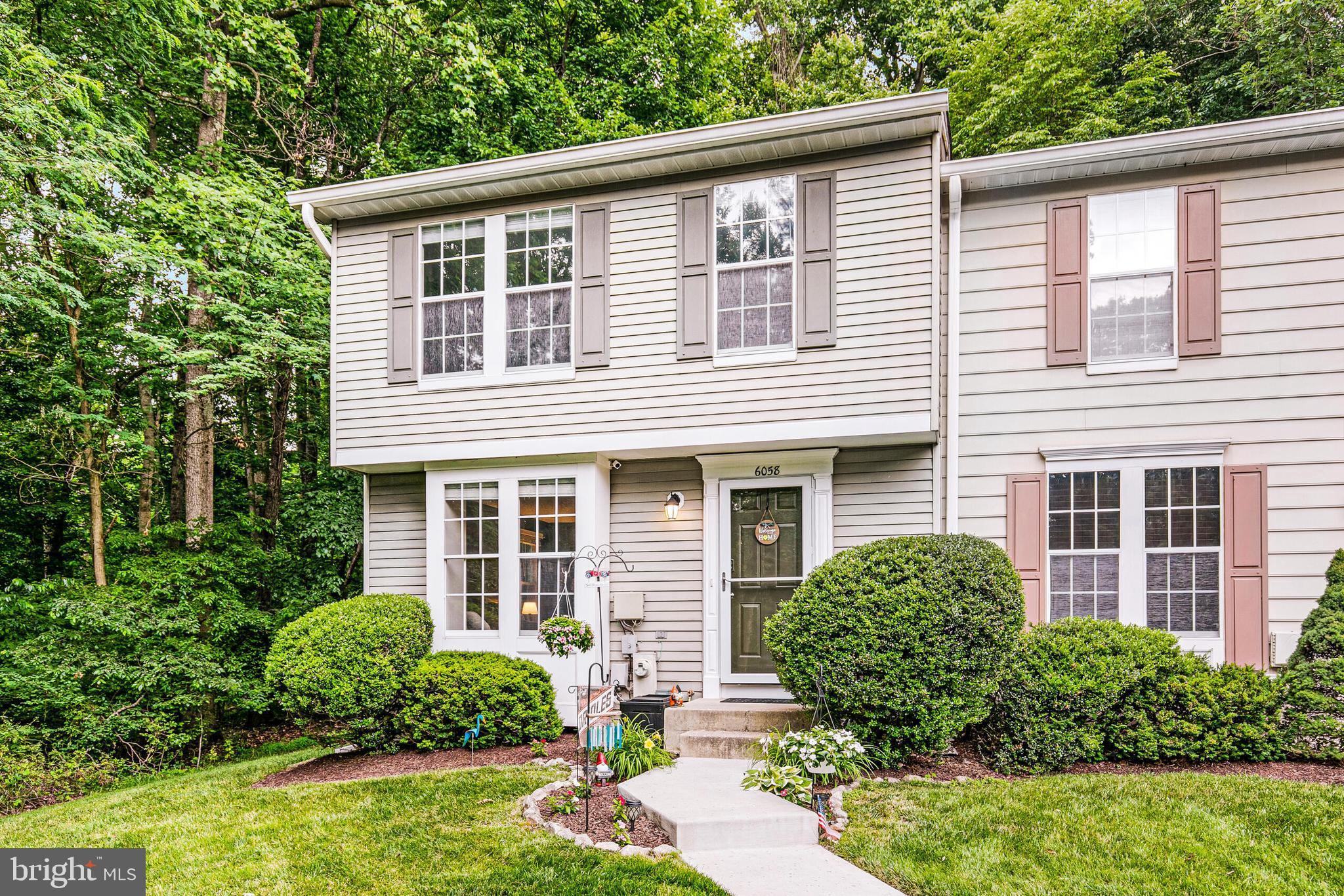 6058 Weekend Way, Unit G38 Columbia, MD 21044 - Photo 3 of 33 a front view of a house with garden