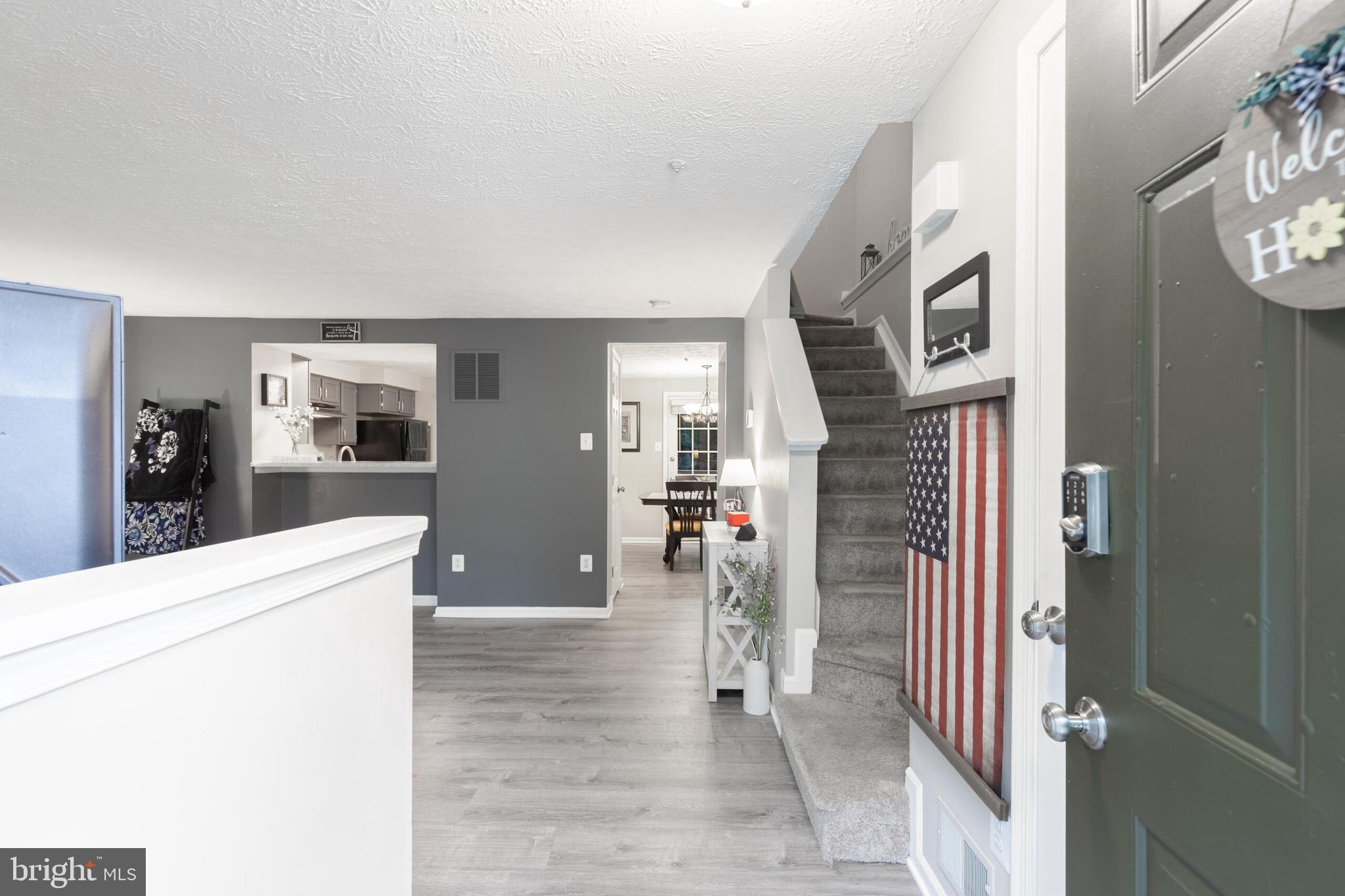 6058 Weekend Way, Unit G38 Columbia, MD 21044 - Photo 4 of 33 a living room with furniture and a flat screen tv