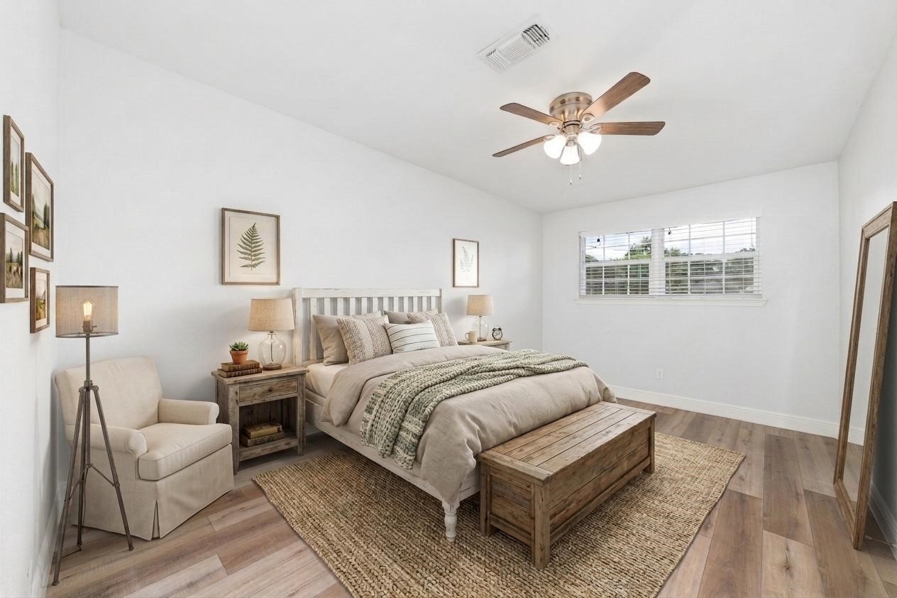 5922 Hummingbird Street Houston, TX 77096 - Photo 19 of 26 Overlooking the backyard, this secondary bedroom feels bright, comfortable, and private. It's perfect for family, guests, or a quiet home office. (VS)
