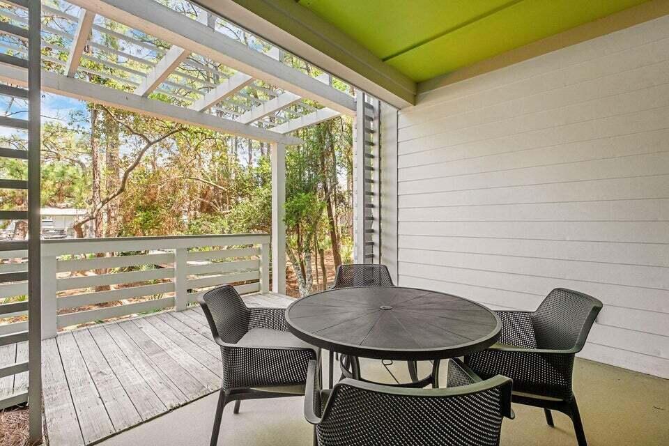 29 Goldenrod Circle, Unit 2014 Santa Rosa Beach, FL 32459 - Photo 12 of 19 a view of a outdoor space with a table and chairs