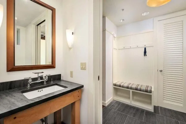 a bathroom with a sink and a mirror