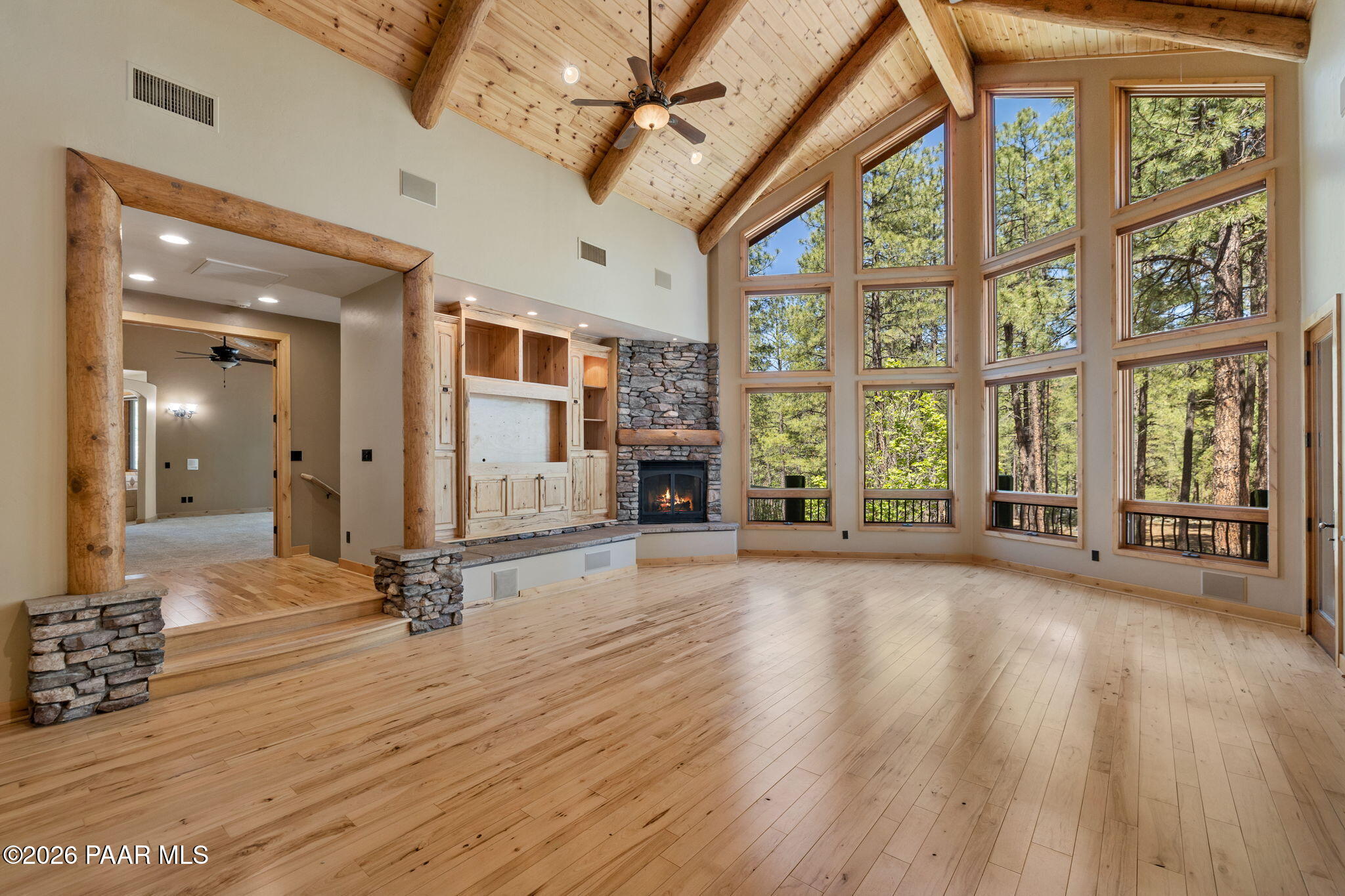 5140 East Charcoal Kiln Road Prescott, AZ 86303 - Photo 15 of 140 a view of an empty room with wooden floor and a window