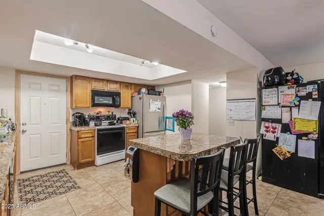a kitchen with a table and chairs in it