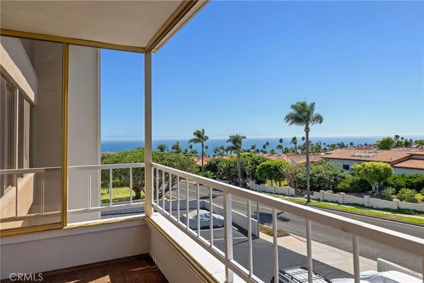 a view of balcony with furniture