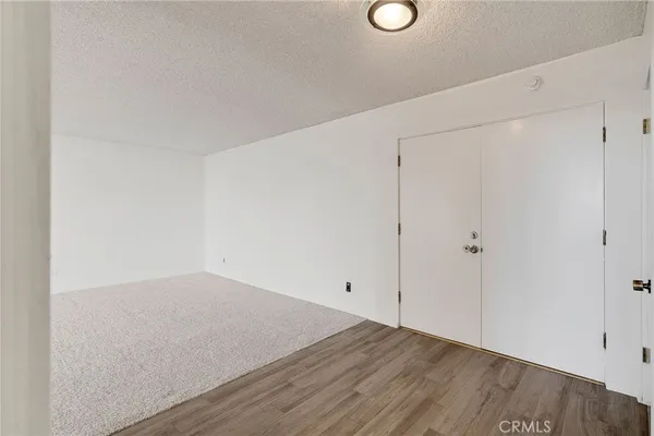 an empty room with wooden floor