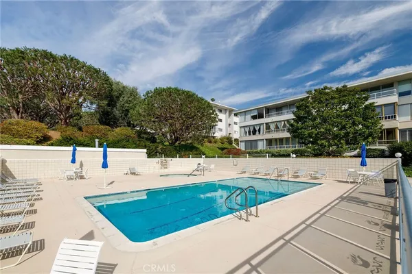 a view of a swimming pool with a patio
