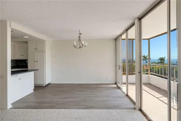 a view of a kitchen from the hallway