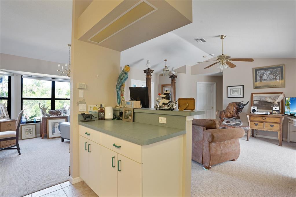 268 Cory Street Port Charlotte, FL 33953 - Photo 11 of 25 a view of living room kitchen with stove and furniture