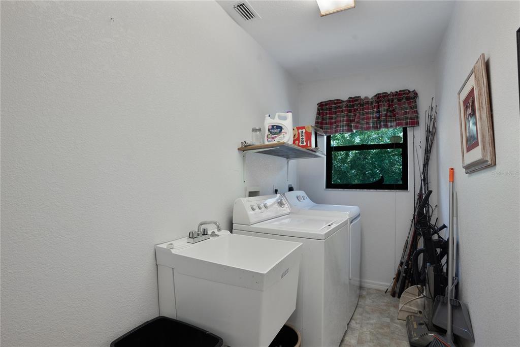 268 Cory Street Port Charlotte, FL 33953 - Photo 12 of 25 a utility room with dryer and washer