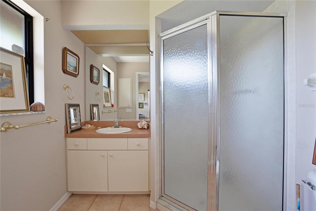 268 Cory Street Port Charlotte, FL 33953 - Photo 16 of 25 a bathroom with a sink and mirror