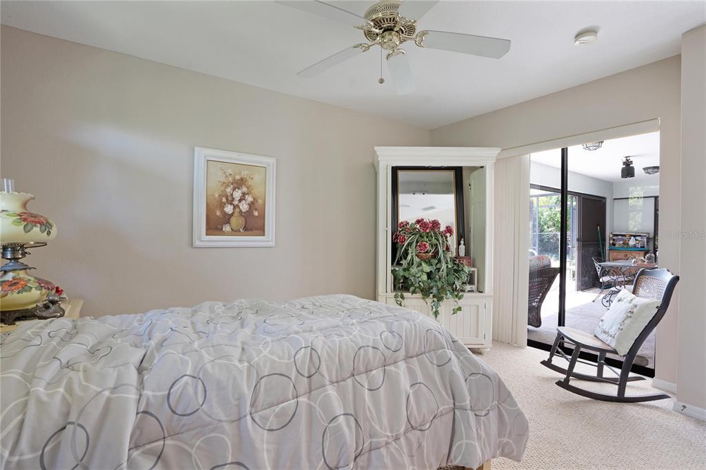 268 Cory Street Port Charlotte, FL 33953 - Photo 19 of 25 a bedroom with a bed and a mirror