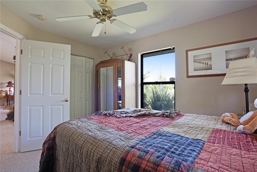 268 Cory Street Port Charlotte, FL 33953 - Photo 21 of 25 a bedroom with a bed and a window