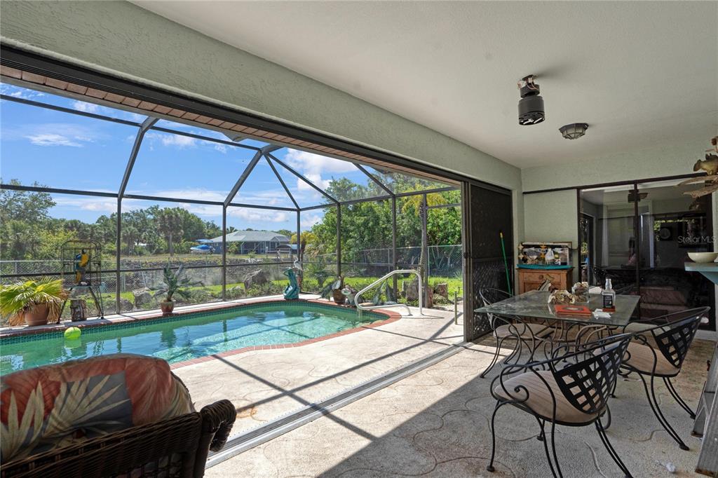 268 Cory Street Port Charlotte, FL 33953 - Photo 22 of 25 a living room with patio furniture and garden