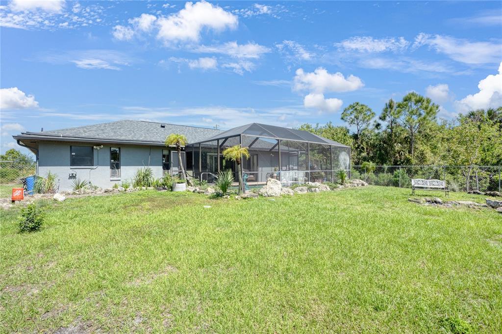 268 Cory Street Port Charlotte, FL 33953 - Photo 24 of 25 a front view of house with yard and green space