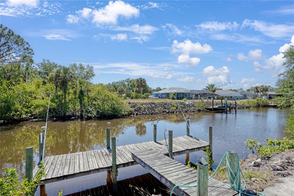268 Cory Street Port Charlotte, FL 33953 - Photo 25 of 25 a view of a lake with couches chairs and lake view