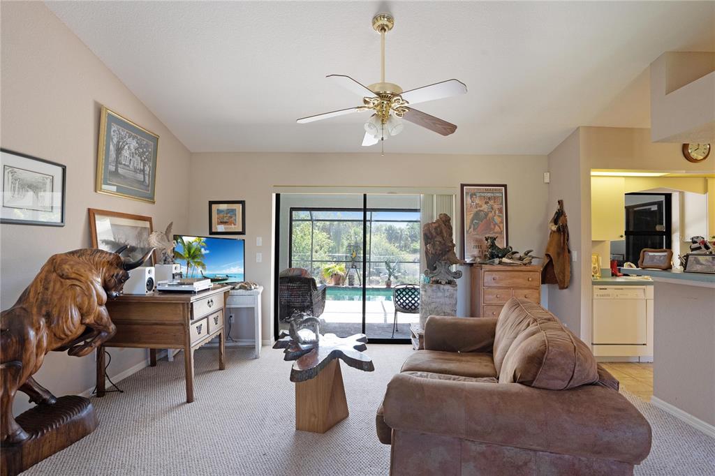 268 Cory Street Port Charlotte, FL 33953 - Photo 4 of 25 a living room with furniture or couches and a large window