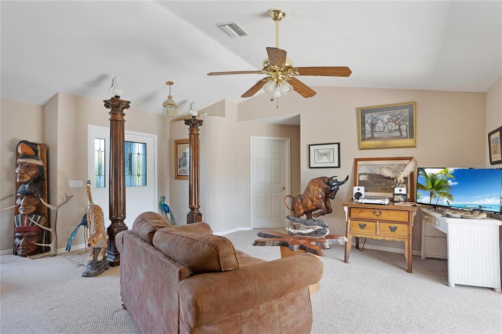 268 Cory Street Port Charlotte, FL 33953 - Photo 7 of 25 a living room with furniture and a flat screen tv