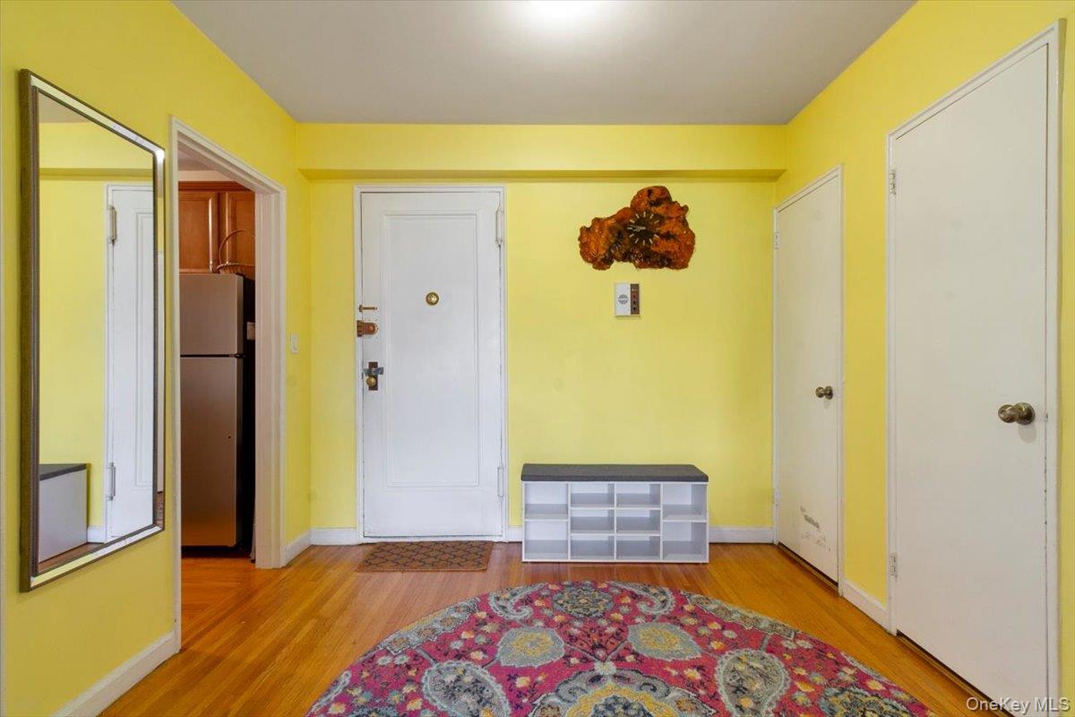142 Garth Road, Unit 2H Scarsdale, NY 10583 - Photo 10 of 14 Foyer entrance featuring baseboards and light wood-style flooring