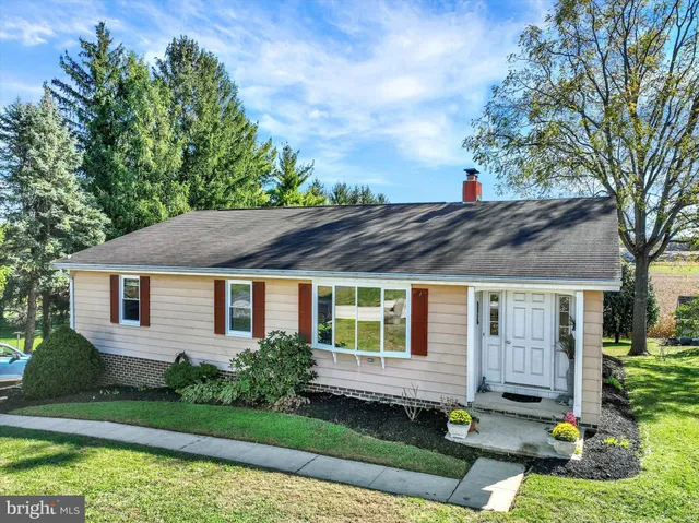 a view of a room with large windows