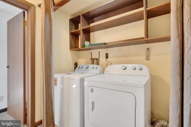 a view of a hallway with a bathroom