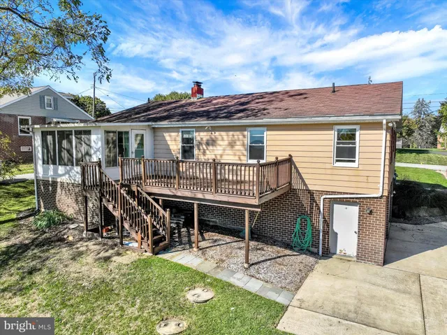 a view of swimming pool with outdoor seating and lake view