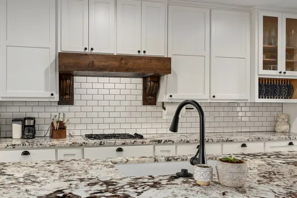 a kitchen with a sink and a stove