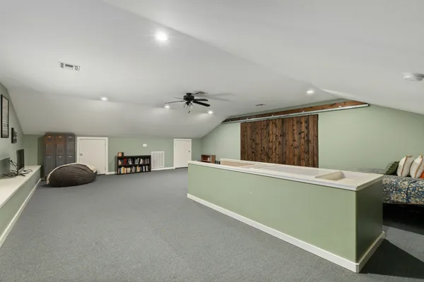 a room with furniture and a ceiling fan