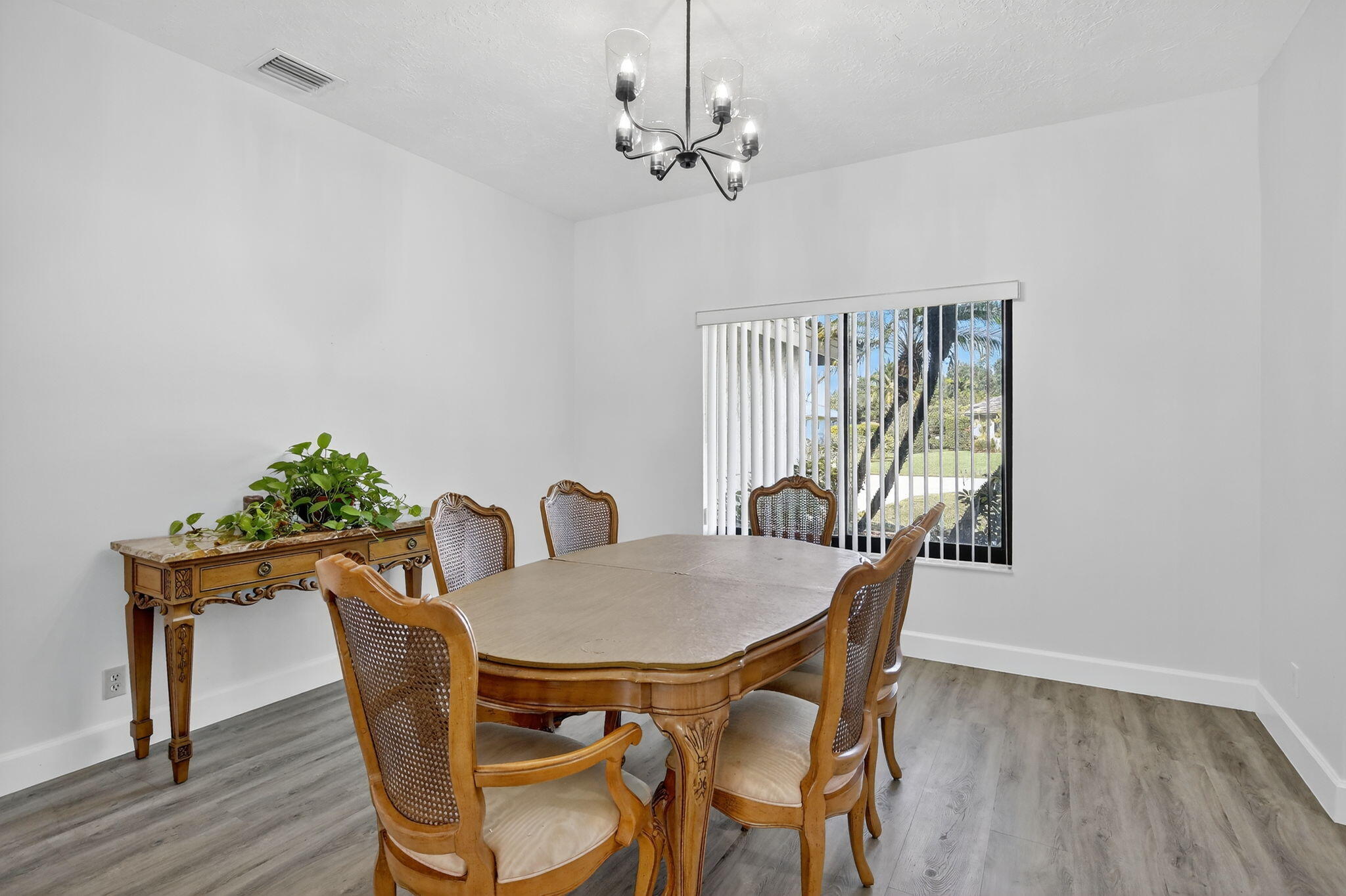 13150 Southwest 16th Court Davie, FL 33325 - Photo 11 of 59 a view of a dining room with furniture window and wooden floor
