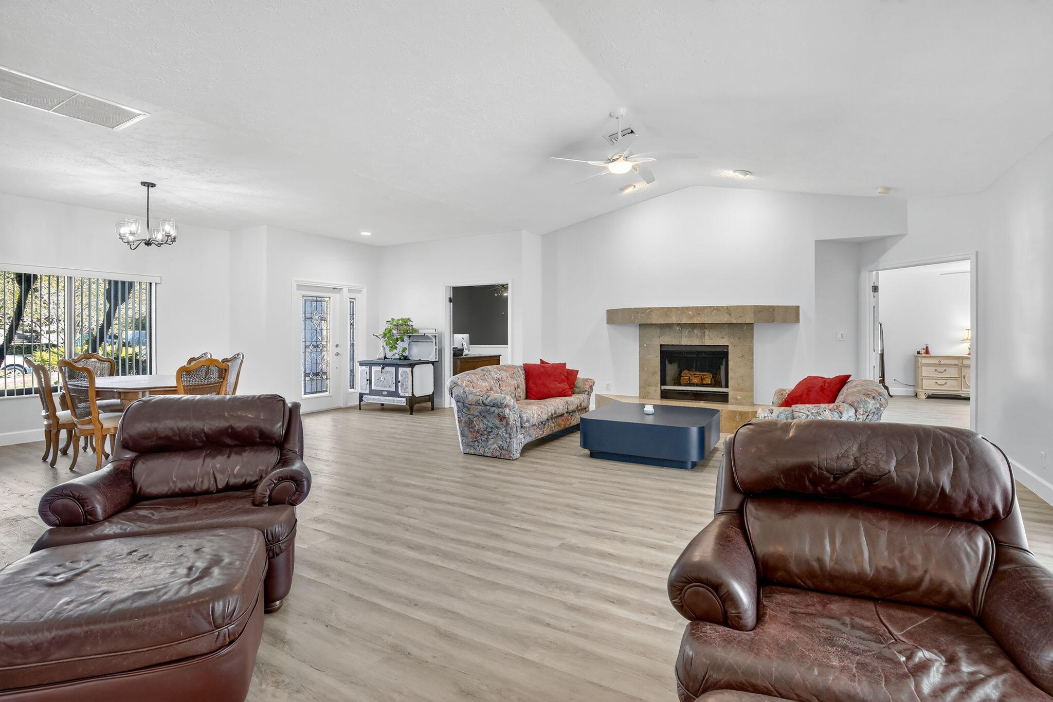 13150 Southwest 16th Court Davie, FL 33325 - Photo 12 of 59 a living room with furniture and a fireplace
