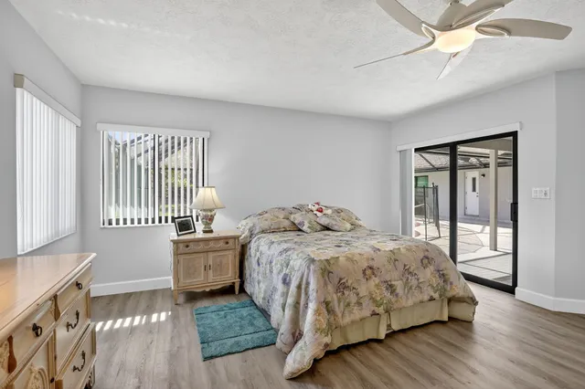 a view of walk in closet with clothes