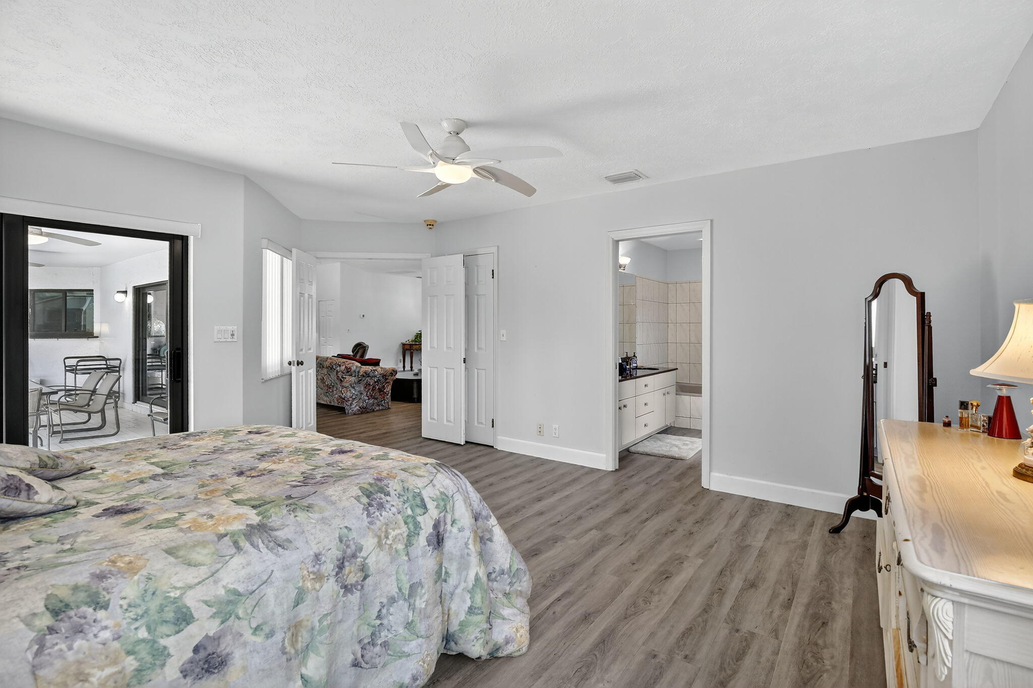 13150 Southwest 16th Court Davie, FL 33325 - Photo 21 of 59 a bedroom with a bed and a mirror