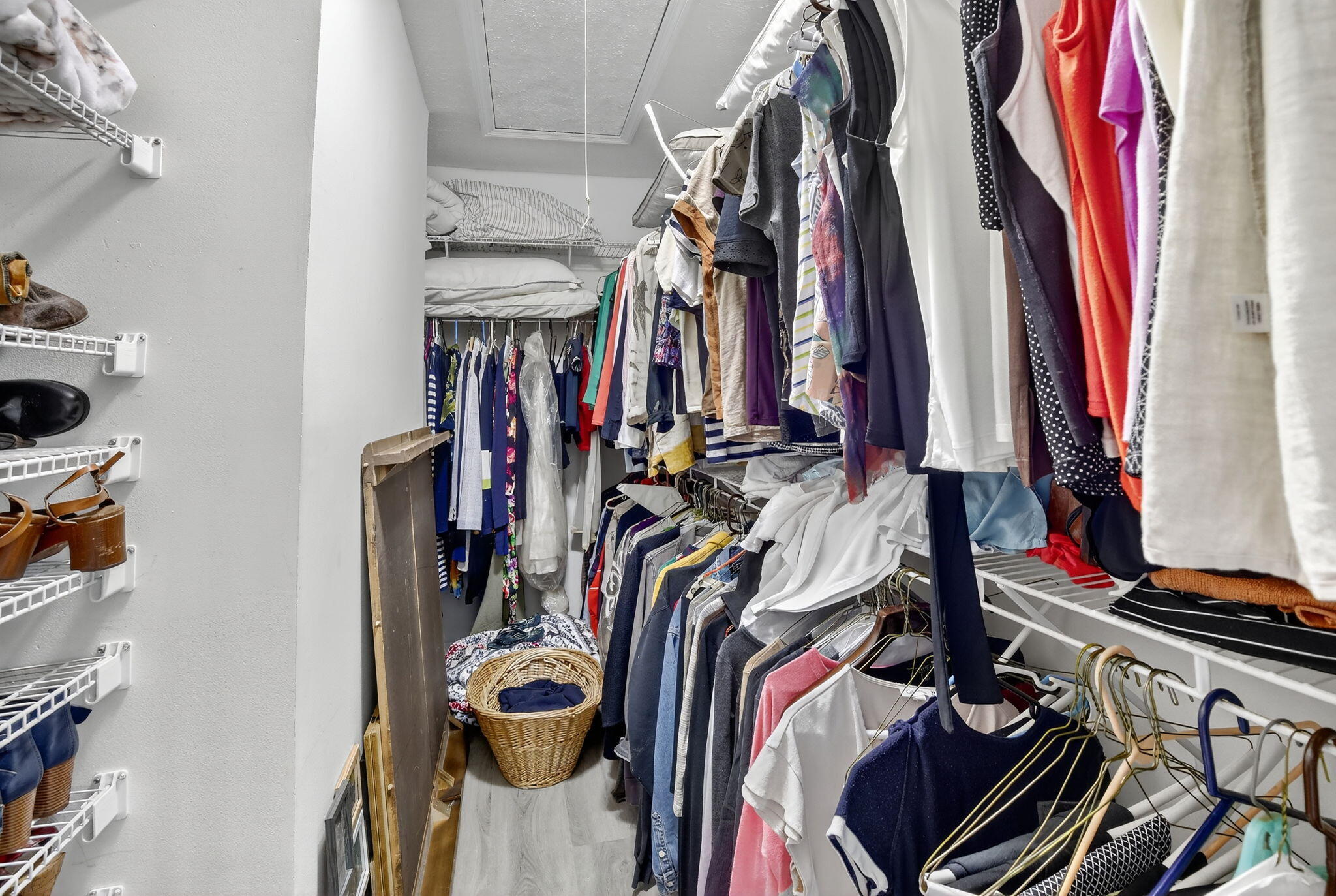 13150 Southwest 16th Court Davie, FL 33325 - Photo 23 of 59 a view of walk in closet with clothes