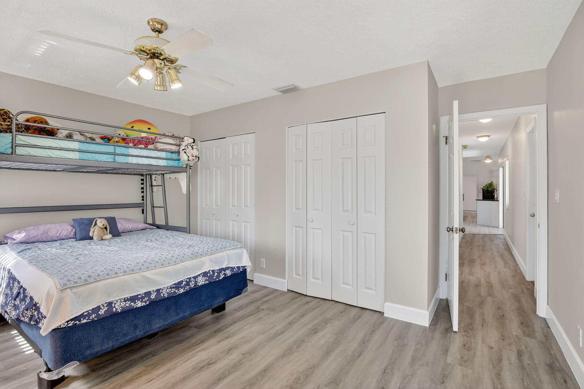 13150 Southwest 16th Court Davie, FL 33325 - Photo 28 of 59 a bedroom with a bed and a chandelier