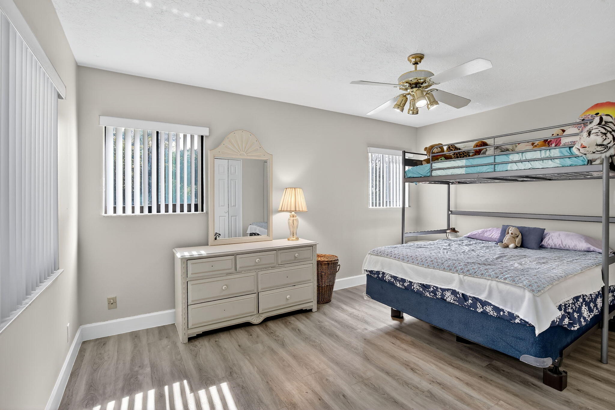 13150 Southwest 16th Court Davie, FL 33325 - Photo 29 of 59 a bedroom with a bed and a chandelier