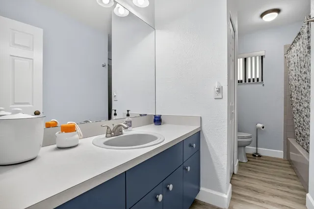 a view of bedroom with wooden floor