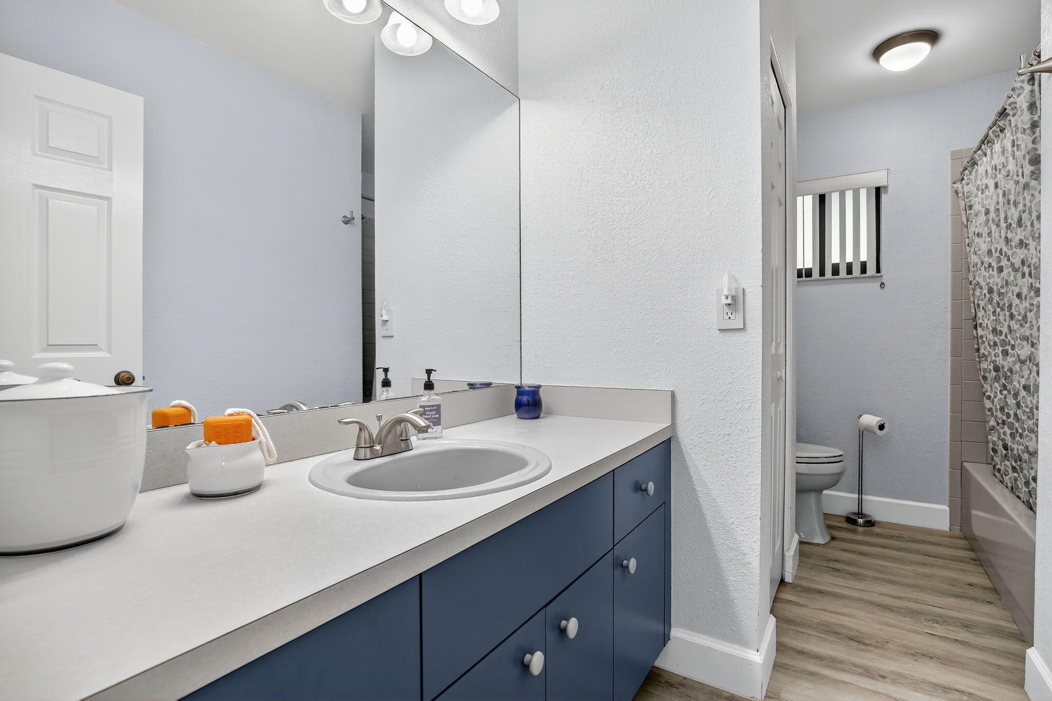 13150 Southwest 16th Court Davie, FL 33325 - Photo 30 of 59 a bathroom with a sink and a mirror