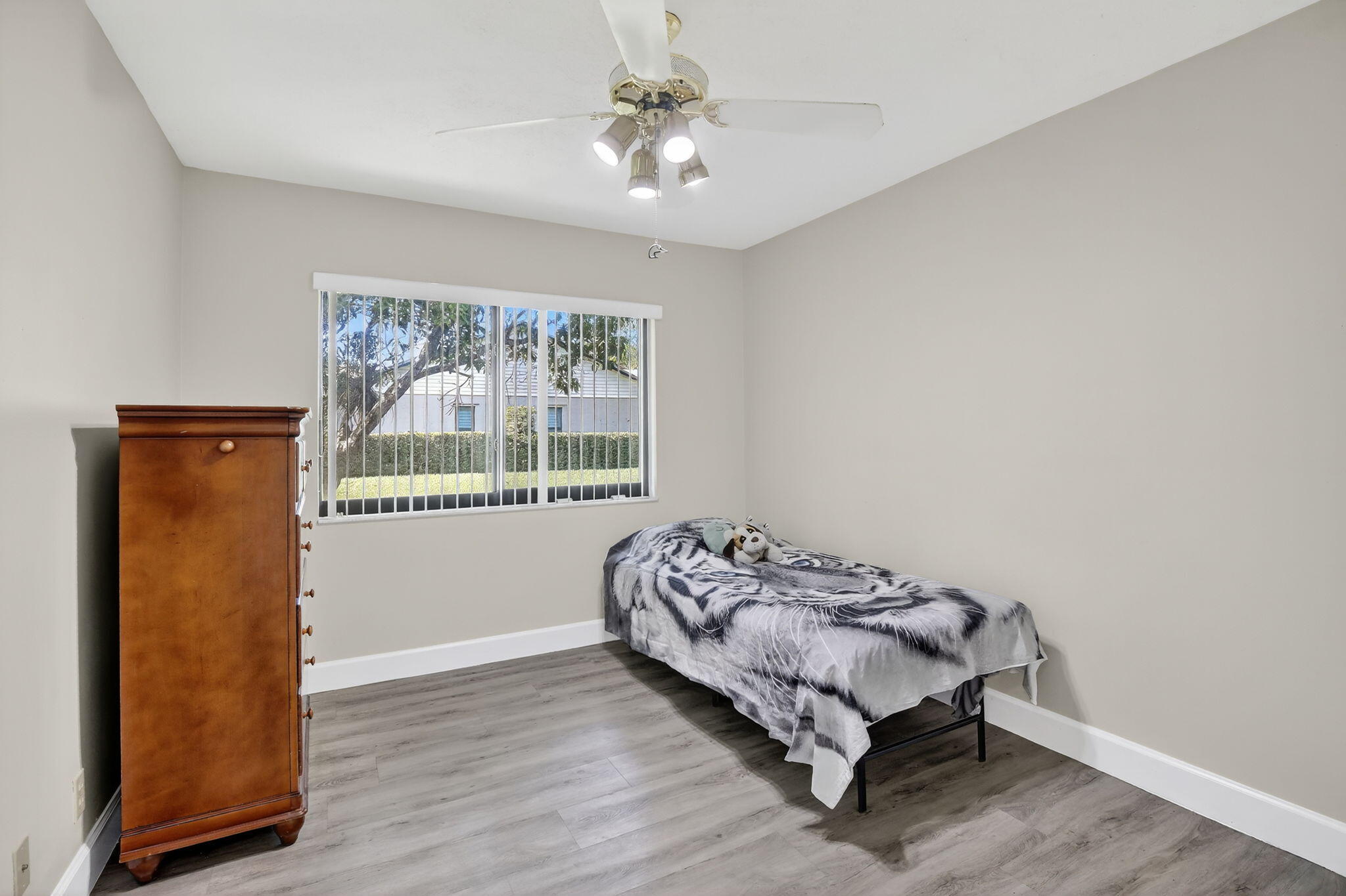 13150 Southwest 16th Court Davie, FL 33325 - Photo 35 of 59 a bed sitting in a bedroom next to a window