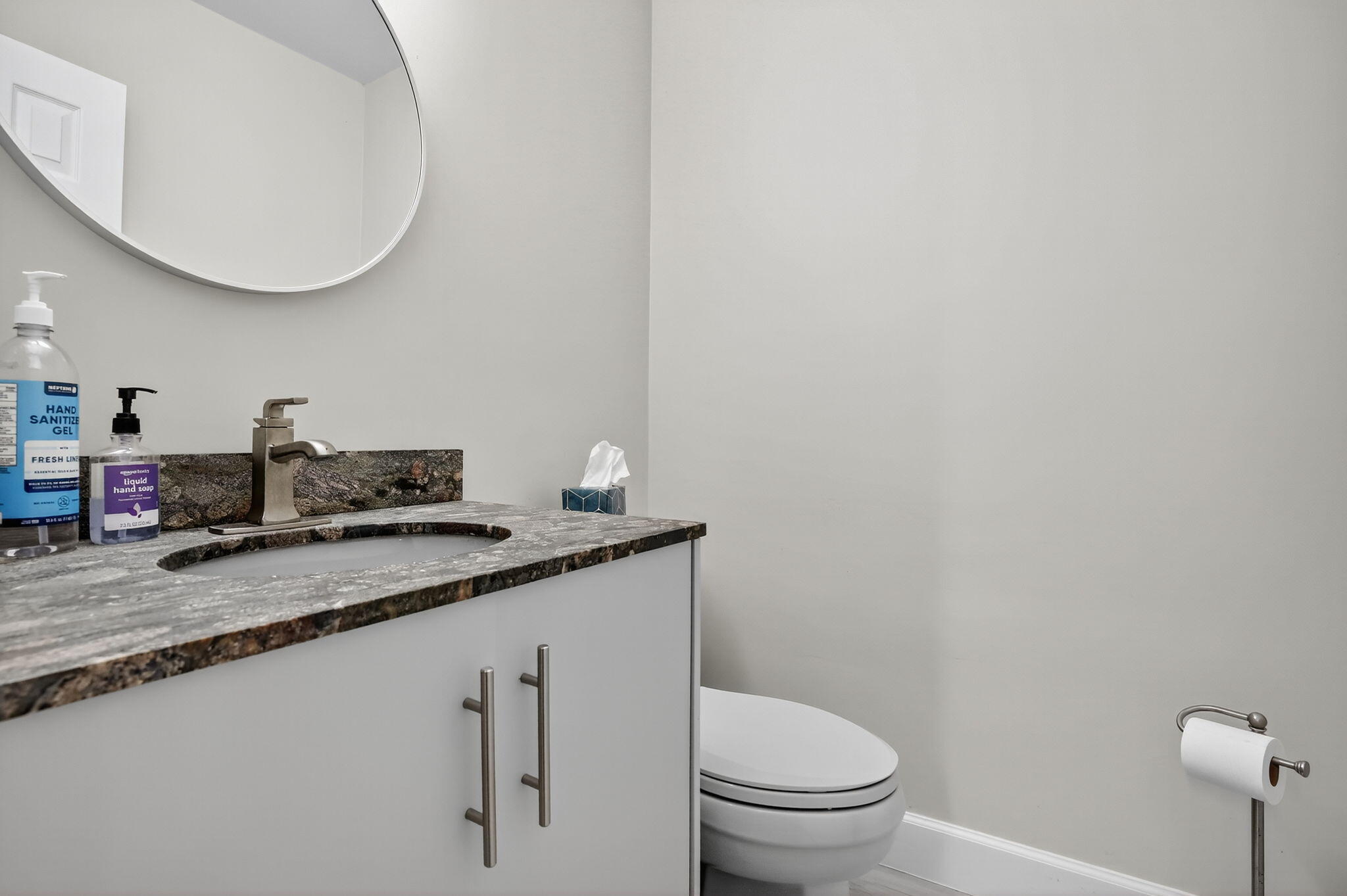 13150 Southwest 16th Court Davie, FL 33325 - Photo 36 of 59 a bathroom with a granite countertop sink a toilet and a mirror