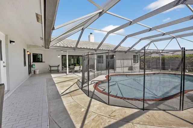 a aerial view of a house with a yard and potted plants